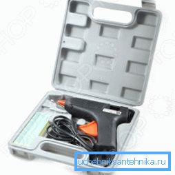 Bildet viser et spesielt verktøy - en pistol for lim (det er praktisk, det kan være nyttig i husholdningen) Bildet viser et spesielt verktøy - en pistol for lim (det er praktisk, det kan være nyttig i husholdningen)