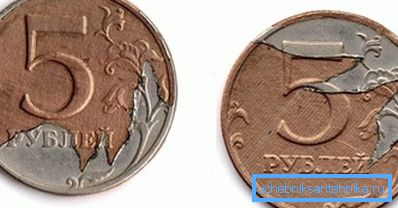 Brokket kledningslag på en 5-rubelmynt. Brokket kledningslag på en 5-rubelmynt.